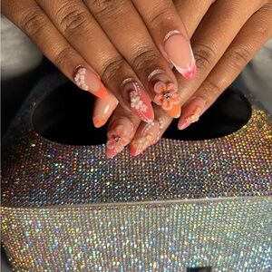 Elegant Floral Nail Art with Orange Accents